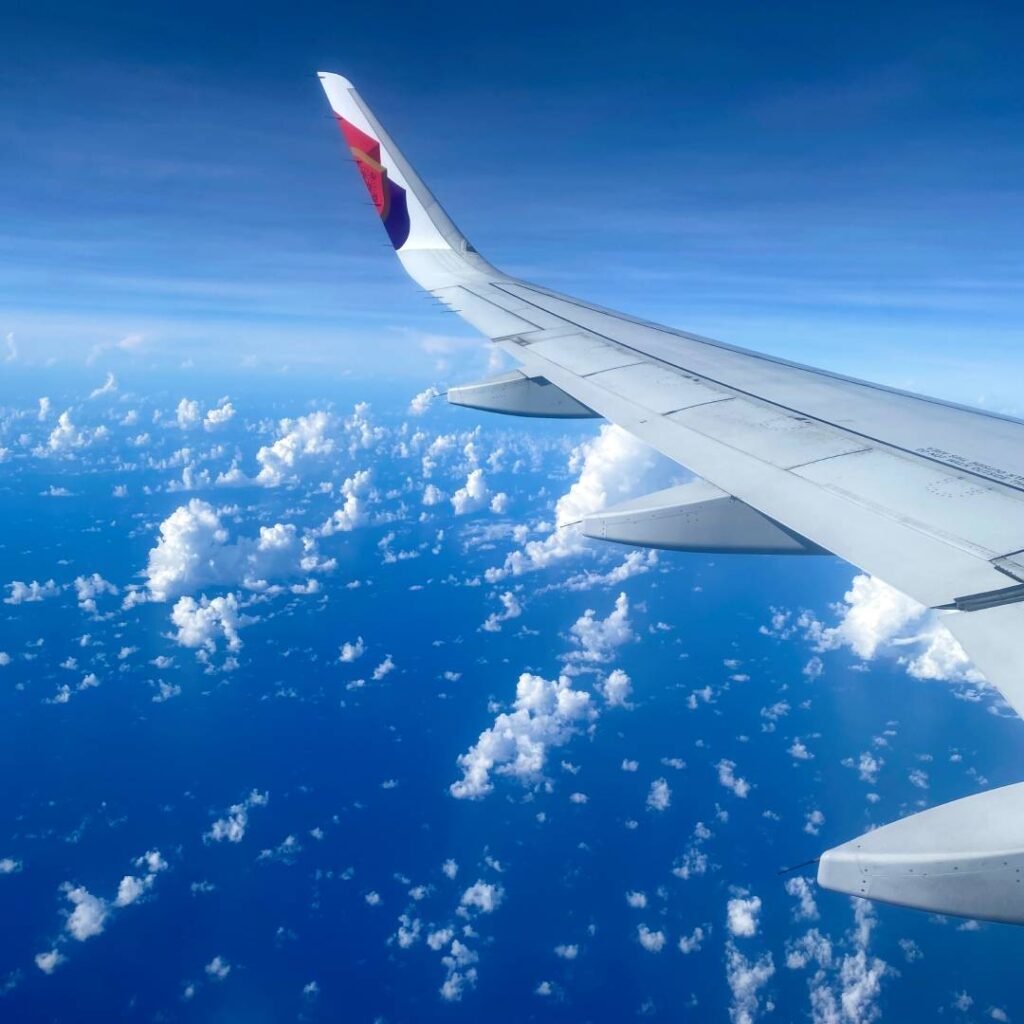Aeroplane wing above the clouds on the flight home to India