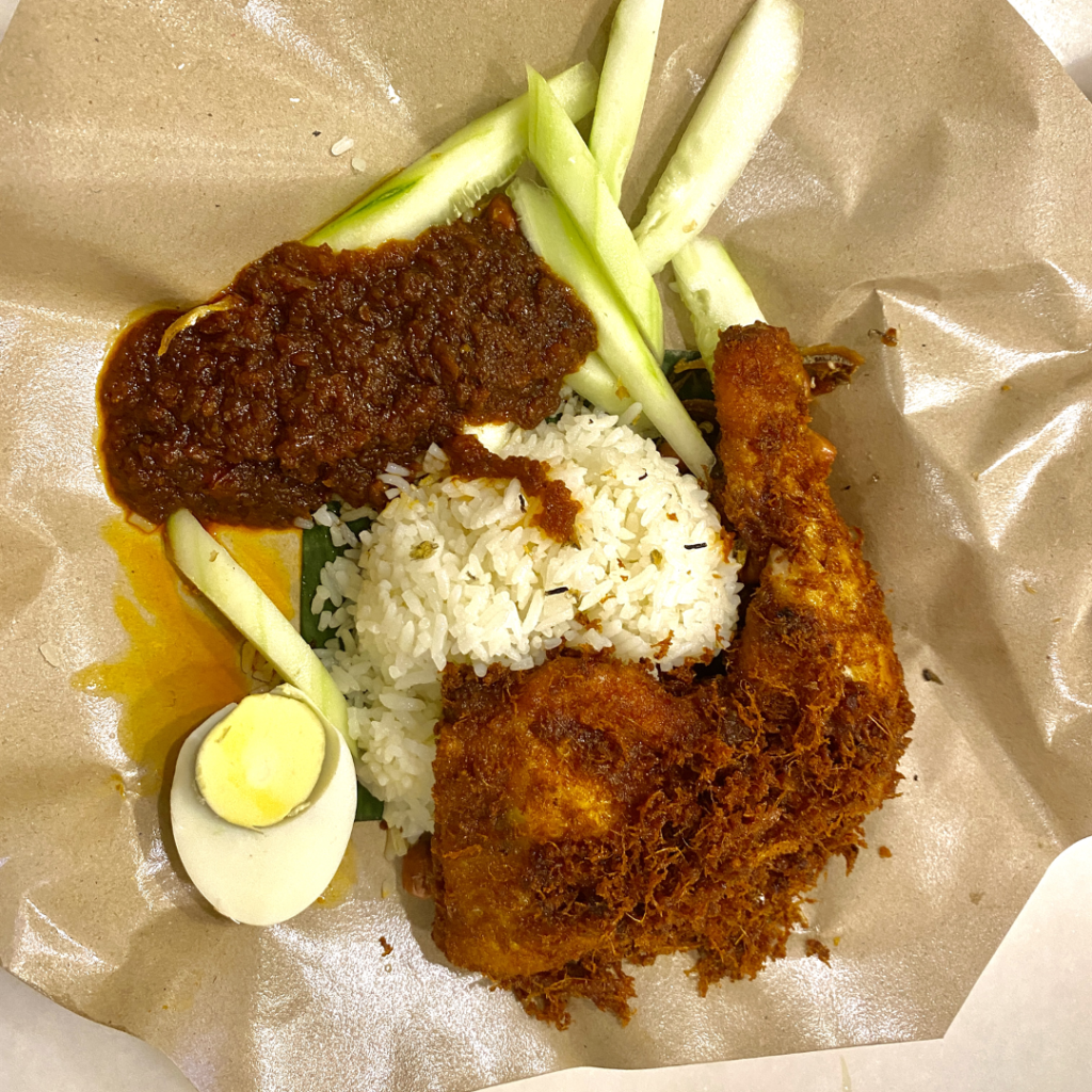 Nasi lemak with fried chicken, sambal, boiled egg and cucumber at Village Park