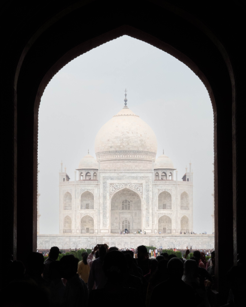 The Taj Mahal framed by a dark archway