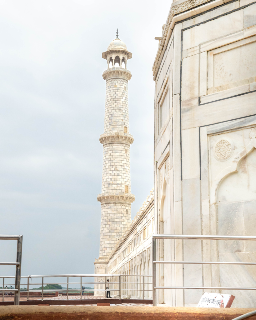 Close-up of a white marble minaret at the Taj Mahal