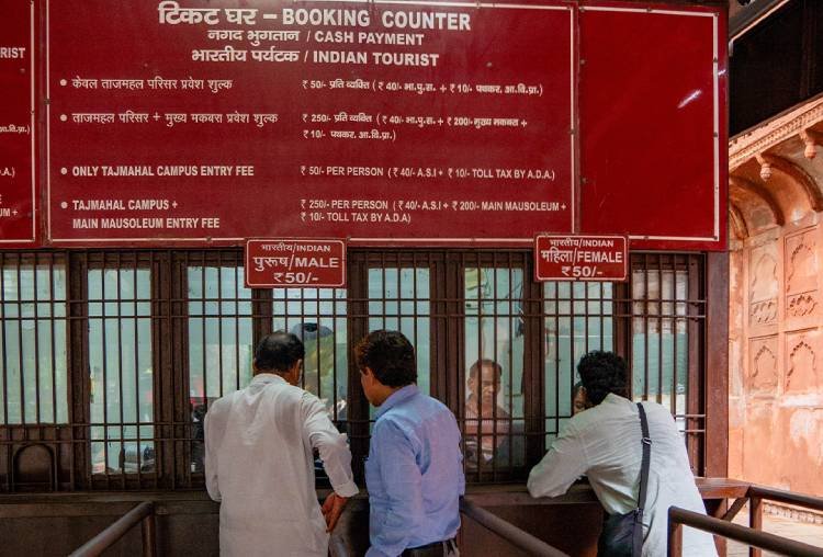 Ticket booking counter at the Taj Mahal with visitors buying tickets