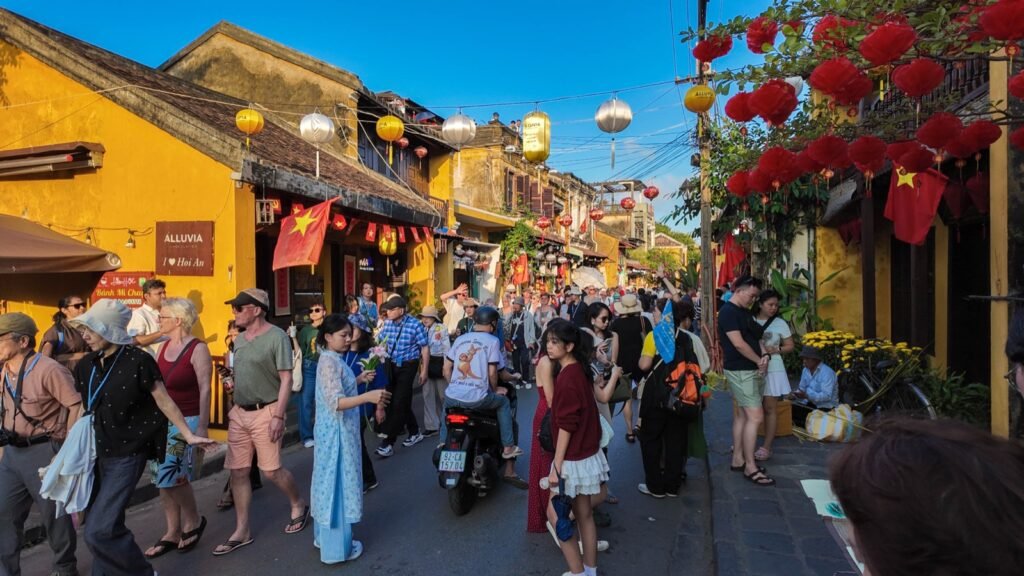 Hoi An Ancient Town street decorated with red lanterns and flags for Tet