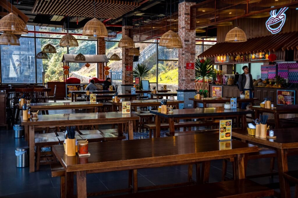 Wooden tables inside a busy food hall in Sapa, Vietnam